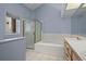 Bathroom with a large tub and double vanity at 7329 Windsor Dr, Boulder, CO 80301