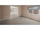 Bright bedroom with carpeting and access to sunroom at 7329 Windsor Dr, Boulder, CO 80301