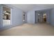 Bedroom with light walls, carpet, and large windows at 7329 Windsor Dr, Boulder, CO 80301