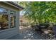 Relaxing deck overlooking backyard, shaded by lush trees at 7329 Windsor Dr, Boulder, CO 80301