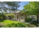 Brick ranch home with attached garage and lush green landscaping at 7329 Windsor Dr, Boulder, CO 80301