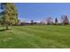 Landscaped golf course with clubhouse in the background at 7329 Windsor Dr, Boulder, CO 80301