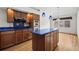 Kitchen with island and stainless steel appliances at 7329 Windsor Dr, Boulder, CO 80301
