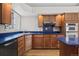 Kitchen with stainless steel appliances and blue countertops at 7329 Windsor Dr, Boulder, CO 80301