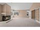 Spacious living room with fireplace and large windows at 7329 Windsor Dr, Boulder, CO 80301