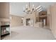Spacious living room with fireplace, high ceilings, and chandelier at 7329 Windsor Dr, Boulder, CO 80301