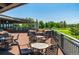 Relaxing patio overlooking the golf course with tables and seating at 7329 Windsor Dr, Boulder, CO 80301