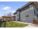 Modern home featuring a well-maintained backyard with a wooden pergola and outdoor seating area at 4180 Kalamath St, Denver, CO 80211