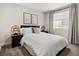 Well-lit bedroom featuring a comfortable bed, matching lamps, and window at 4180 Kalamath St, Denver, CO 80211