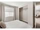 Inviting bedroom featuring a spacious closet and ample natural light at 4180 Kalamath St, Denver, CO 80211