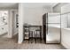 Basement kitchenette including mini-fridge, bar and sink convenient for guests at 4180 Kalamath St, Denver, CO 80211