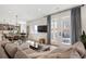 Bright living room featuring a comfortable couch, backyard view, and an open layout with a kitchen at 4180 Kalamath St, Denver, CO 80211