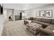 Spacious finished basement featuring modern gray furnishings and an entertainment area at 4180 Kalamath St, Denver, CO 80211