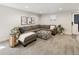Comfortable finished basement featuring modern gray furnishings and natural light at 4180 Kalamath St, Denver, CO 80211