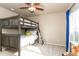 bedroom featuring a wooden bunk bed, carpeted floors, and a ceiling fan with light at 802 Gamble Oak St, Brighton, CO 80601