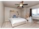 Comfortable bedroom with carpeted floors, natural light, and a desk for studying or hobbies at 802 Gamble Oak St, Brighton, CO 80601