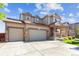 Charming two-story home featuring a two-car garage and inviting front porch at 802 Gamble Oak St, Brighton, CO 80601