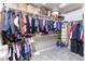 Walk-in closet with ample shelving and hanging space for storage and organization at 802 Gamble Oak St, Brighton, CO 80601