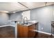 A modern kitchen with stainless steel appliances, light wood cabinets, and industrial accents at 500 E 11Th Ave # 102, Denver, CO 80203