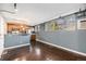 A modern kitchen with stainless steel appliances, light wood cabinets, and industrial accents at 500 E 11Th Ave # 102, Denver, CO 80203