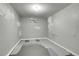 Unfinished basement room with small window and painted walls and floor at 9095 Beechwood Dr, Thornton, CO 80229