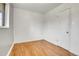 Simple bedroom with neutral walls and hardwood flooring at 9095 Beechwood Dr, Thornton, CO 80229