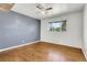Comfortable bedroom features hardwood floors, soothing paint colors, and ample natural light at 9095 Beechwood Dr, Thornton, CO 80229
