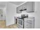 Bright kitchen features a stove, gray cabinets, and laminate countertops at 9095 Beechwood Dr, Thornton, CO 80229