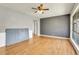 Spacious living room featuring hardwood floors, neutral paint colors, and a ceiling fan at 9095 Beechwood Dr, Thornton, CO 80229