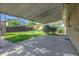 Covered patio area overlooking the spacious, grassy backyard of the home at 9095 Beechwood Dr, Thornton, CO 80229