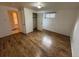 Bedroom with laminate floors and closet at 3770 S Ulster St, Denver, CO 80237