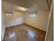 Bedroom with light colored walls, carpet and two windows at 3770 S Ulster St, Denver, CO 80237