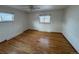 Bedroom featuring hardwood floors, bright windows and a ceiling fan at 3770 S Ulster St, Denver, CO 80237