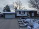 Charming single-Gathering home with a two-car garage and well-maintained front yard covered in snow at 3770 S Ulster St, Denver, CO 80237