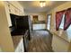 Bright kitchen with granite countertops, stainless steel appliances, and new plank floors at 3770 S Ulster St, Denver, CO 80237