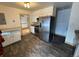 Kitchen featuring stainless steel appliances, granite counters, and modern plank flooring at 3770 S Ulster St, Denver, CO 80237