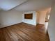 Spacious living room featuring hardwood floors and a built-in display case at 3770 S Ulster St, Denver, CO 80237