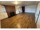 Spacious living room with hardwood floors and a lovely fireplace and bookshelves at 3770 S Ulster St, Denver, CO 80237
