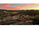 Fenced backyard with a firepit and a picturesque landscape view in the background at 2430 Marlin Way, Castle Rock, CO 80109