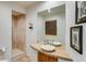 Modern bathroom featuring a walk-in shower, a stylish sink, and contemporary decor at 2430 Marlin Way, Castle Rock, CO 80109