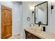 Chic bathroom with unique vessel sink, designer mirror, and modern fixtures at 2430 Marlin Way, Castle Rock, CO 80109