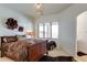 Well-lit bedroom featuring a full-size bed, decorative wall art, and a comfortable ambiance at 2430 Marlin Way, Castle Rock, CO 80109