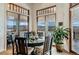 Elegant dining room featuring hardwood floors, stylish furniture, and abundant natural light with stunning views at 2430 Marlin Way, Castle Rock, CO 80109