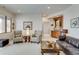 Cozy living room with comfortable seating, a wet bar, and ample space for relaxation and entertainment at 2430 Marlin Way, Castle Rock, CO 80109