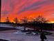 Striking sunset view over the home and landscape, creating a dramatic and colorful scene at 2430 Marlin Way, Castle Rock, CO 80109