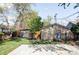 View of the backyard featuring a large concrete patio, fenced yard and storage shed at 1610 Xanthia St, Denver, CO 80220