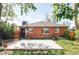 Charming brick home featuring patio and backyard, perfect for outdoor enjoyment at 1610 Xanthia St, Denver, CO 80220
