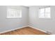 Bright bedroom with hardwood floors and dual windows creating a welcoming space at 1610 Xanthia St, Denver, CO 80220