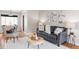 Bright living area boasts hardwood floors, modern decor, and ample seating, perfect for relaxation and entertaining at 1610 Xanthia St, Denver, CO 80220