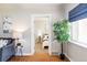 Bright living room view to bedroom, showcasing open layout and hardwood floors at 1610 Xanthia St, Denver, CO 80220